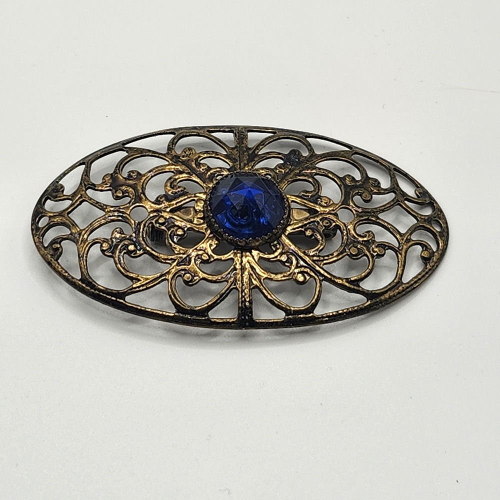 Vintage Antique Gold Tone Filigree Oval Brooch with Blue Rhinestone Center